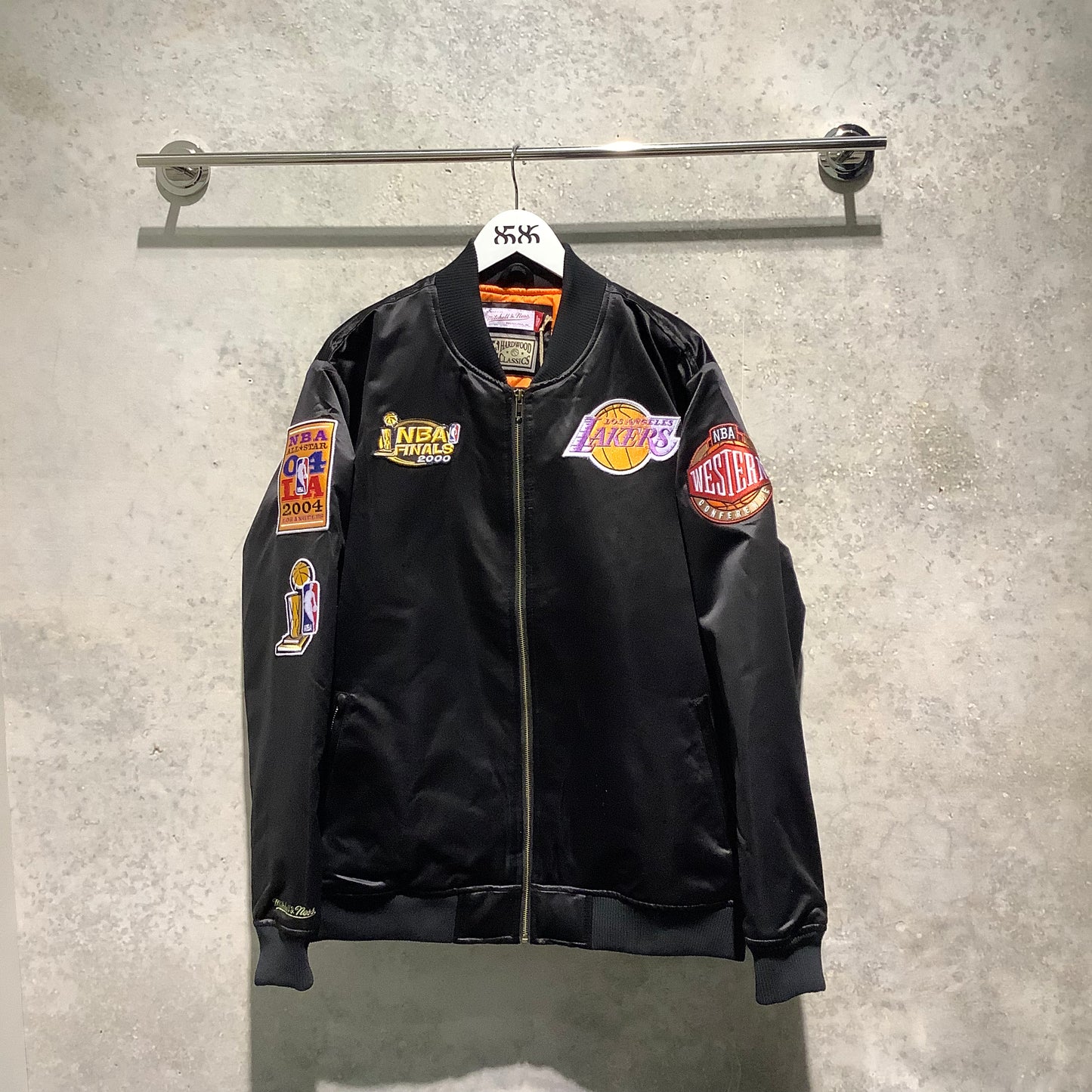 Mitchell & Ness: NBA FLIGHT SATIN BOMBER JACKET LA LAKERS ( front view on hanger)