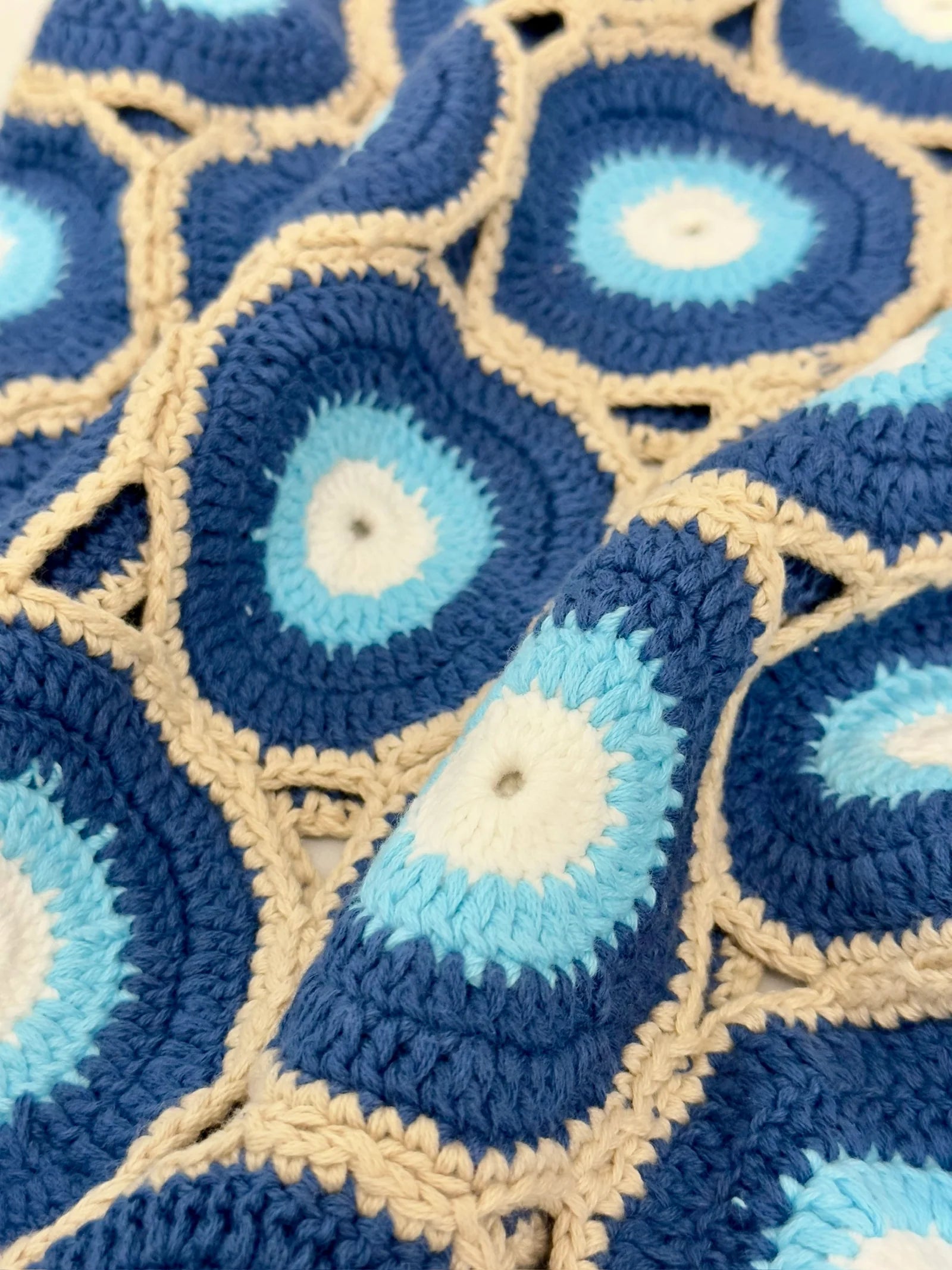 MARVANS: EVIL EYE KNIT SHIRT (close up of crochet)
