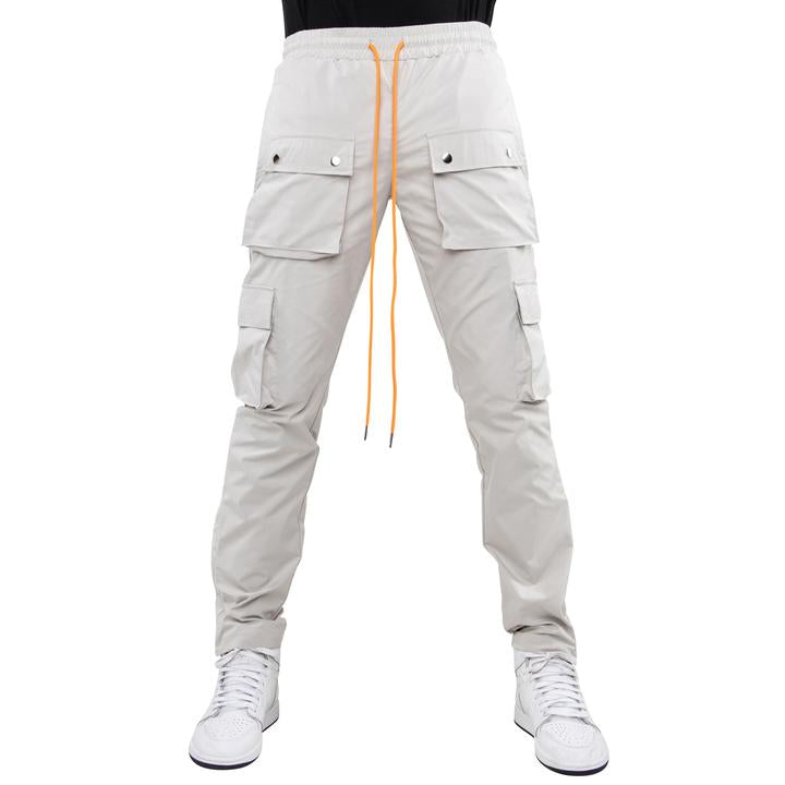 EPTM SNAP GARGO PANTS (grey with orange strings- front view)
Self: 100% Polyester
relaxed fit
reflective logo at the cargo pocket
adjustable toggle at the bottom