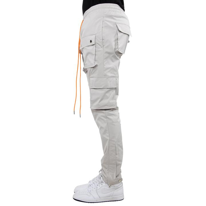 EPTM SNAP GARGO PANTS (grey with orange strings- side view)
Self: 100% Polyester
relaxed fit
reflective logo at the cargo pocket
adjustable toggle at the bottom