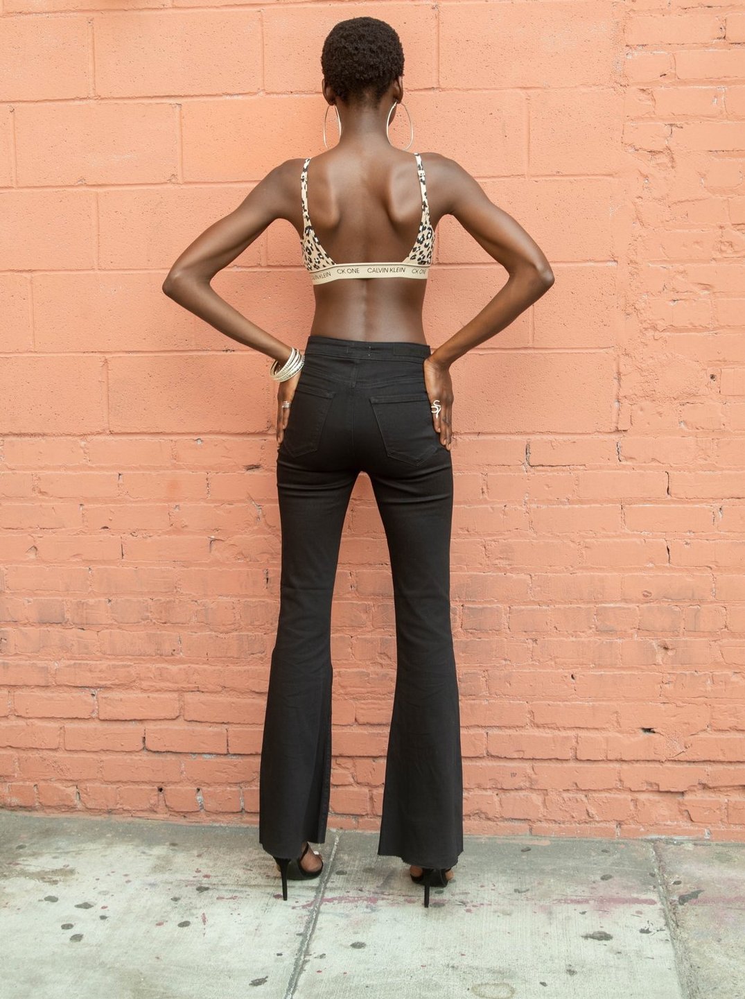 CELLO: HIGH WAISTED FLARE JEANS (black back view on model)